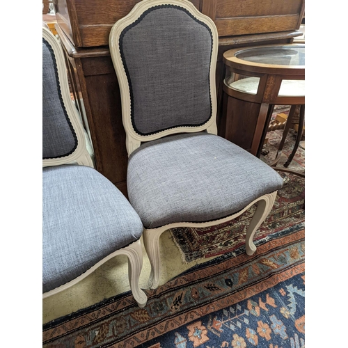 108 - A pair of grey upholstered dining chairs