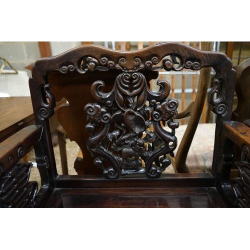 113 - A pair of Chinese carved hongmu elbow chairs (a.f.), width 65cm, depth 48cm, height 96cm... 