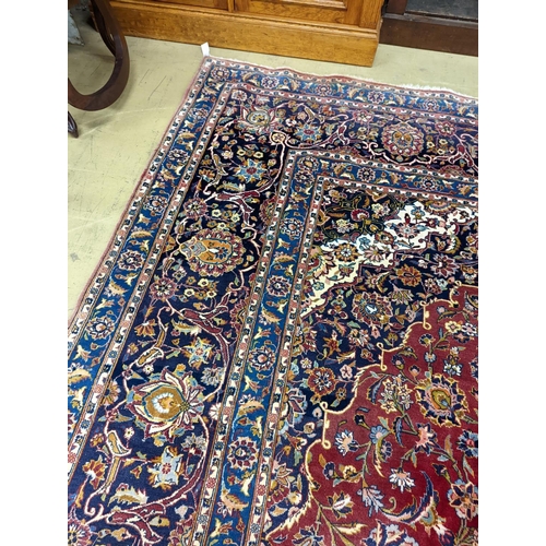 114 - A large Tabriz red ground floral carpet, 540 x 350cm