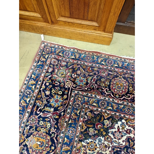 114 - A large Tabriz red ground floral carpet, 540 x 350cm