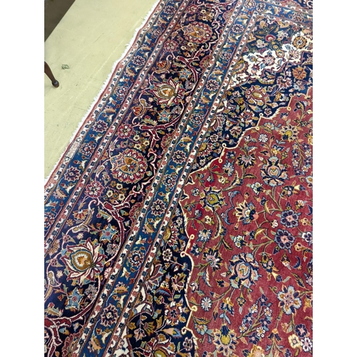 114 - A large Tabriz red ground floral carpet, 540 x 350cm