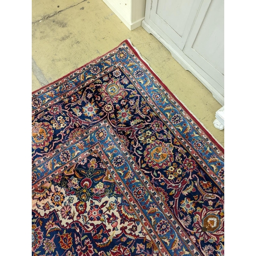 114 - A large Tabriz red ground floral carpet, 540 x 350cm