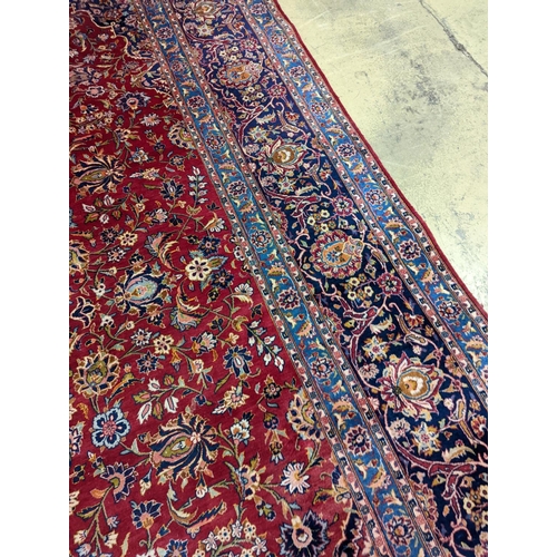 114 - A large Tabriz red ground floral carpet, 540 x 350cm