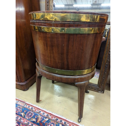 122 - A George III mahogany triple brass bound oval wine cooler on stand, width 56cm, depth 43cm, height 7... 