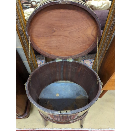 122 - A George III mahogany triple brass bound oval wine cooler on stand, width 56cm, depth 43cm, height 7... 