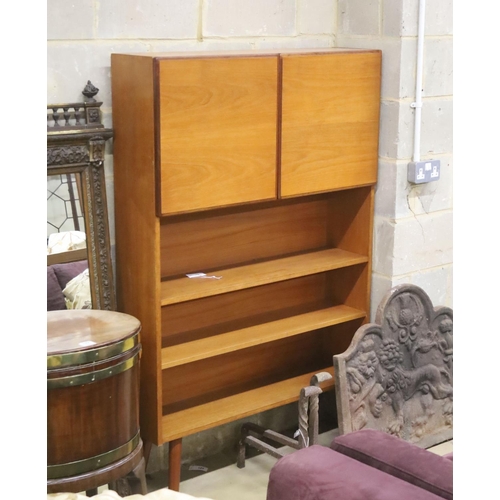 123 - A mid century style teak two door side cabinet, width 102cm, depth 26cm, height 156cm