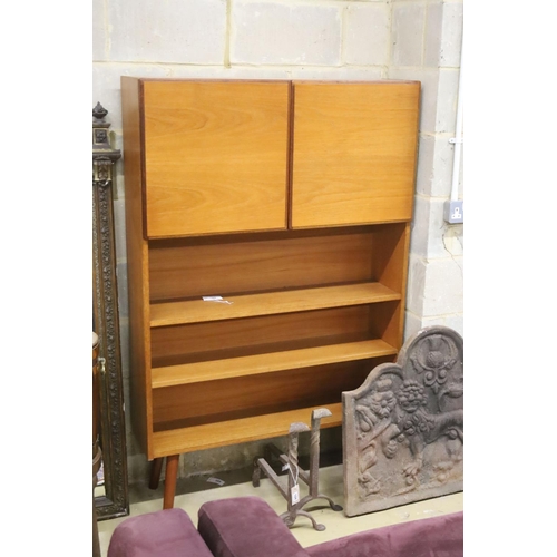 123 - A mid century style teak two door side cabinet, width 102cm, depth 26cm, height 156cm