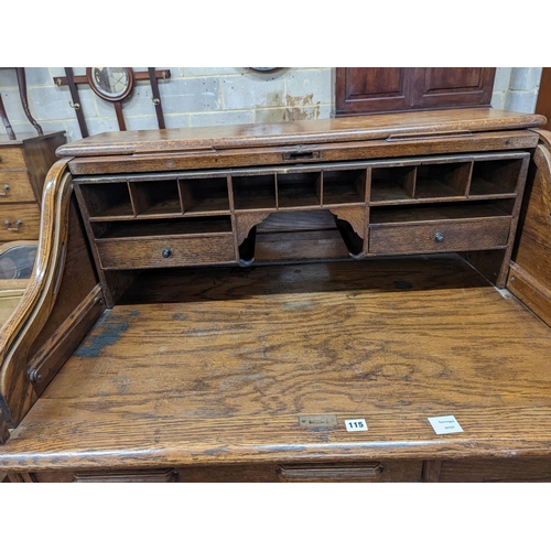 132 - An early 20th century oak roll top desk with 'S' shaped tambour, width 106cm, depth 75cm, height 119... 