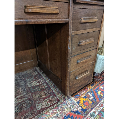 132 - An early 20th century oak roll top desk with 'S' shaped tambour, width 106cm, depth 75cm, height 119... 