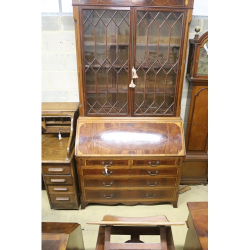 133 - A George III style inlaid mahogany bureau bookcase, length 132cm, depth 57cm, height 276cm... 