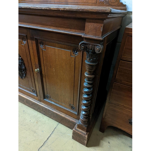 138 - A Victorian oak side cabinet, length 150cm, depth 62cm, height 130cm