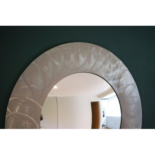 139 - A brushed steel circular wall mirror, 96cm