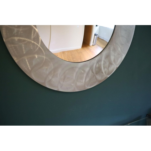 139 - A brushed steel circular wall mirror, 96cm