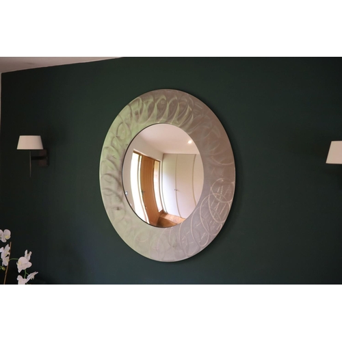 139 - A brushed steel circular wall mirror, 96cm