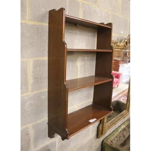 147 - A mahogany three shelf wall bracket, width 57cm, depth 23cm, height 94cm