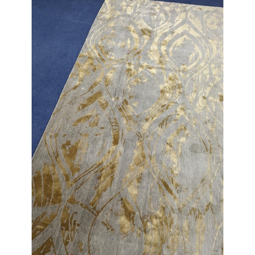 153 - A contemporary 'Son' Nepalese wool and silk stone grey and gold carpet, 490 x 270cm