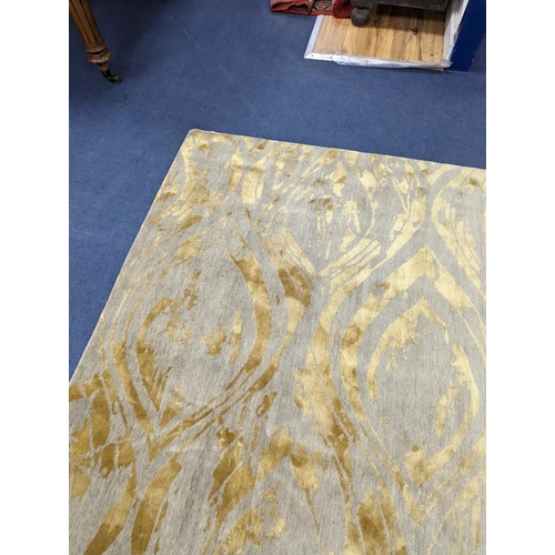 153 - A contemporary 'Son' Nepalese wool and silk stone grey and gold carpet, 490 x 270cm