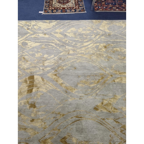 153 - A contemporary 'Son' Nepalese wool and silk stone grey and gold carpet, 490 x 270cm