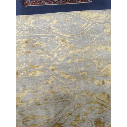 153 - A contemporary 'Son' Nepalese wool and silk stone grey and gold carpet, 490 x 270cm