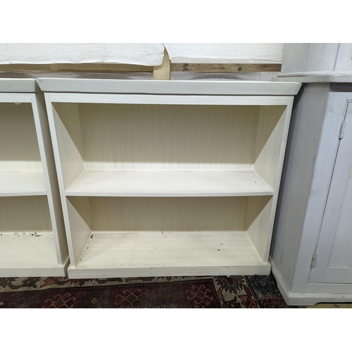 16 - A pair of modern white painted dwarf open bookcases, length 90cm, depth 30cm, height 82cm... 