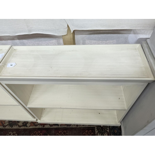 16 - A pair of modern white painted dwarf open bookcases, length 90cm, depth 30cm, height 82cm... 