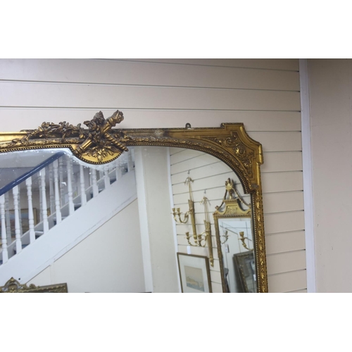 166 - A large Victorian giltwood and gesso overmantel mirror, width 160cm, height 232cm