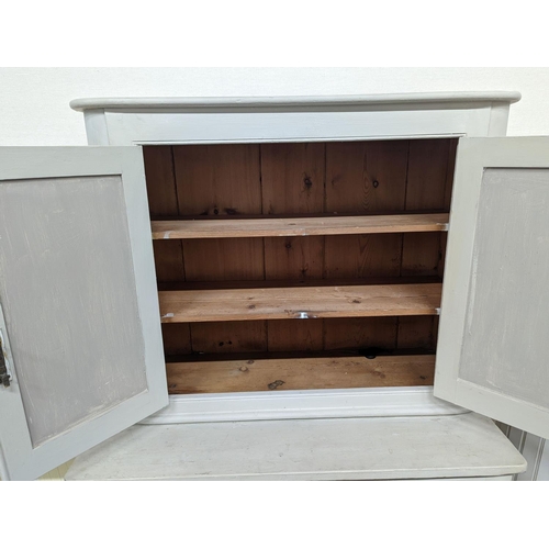 17 - A white painted two section kitchen cupboard of small proportions, width 91cm, depth 47cm, height 15... 