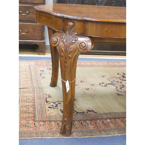 172 - A Queen Anne revival burr walnut shaped oval extending dining table, 272cm extended, one spare leaf,... 