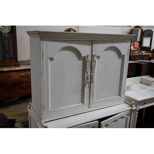 18 - A painted four door cabinet, width 118cm, depth 60cm, height 152cm