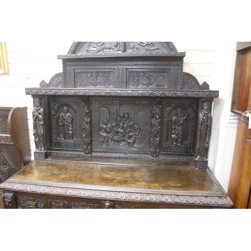 180 - A late 19th century Flemish carved oak sideboard with raised panelled back, width 150, depth 60, hei... 