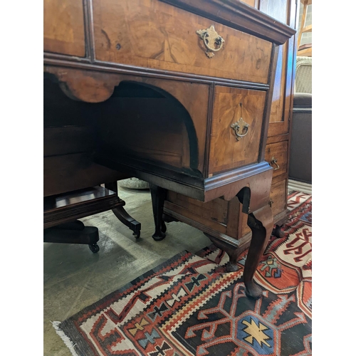 22 - A Queen Anne revival banded walnut kneehole dressing table, width 102cm, depth 48cm, height 75cm... 