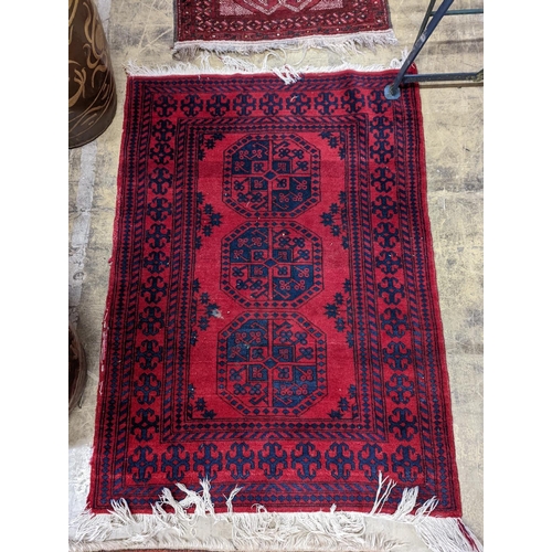 24 - Three Bokhara rugs, largest 134 x 99cm