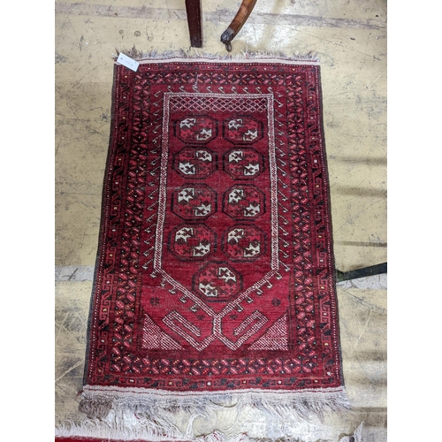 24 - Three Bokhara rugs, largest 134 x 99cm