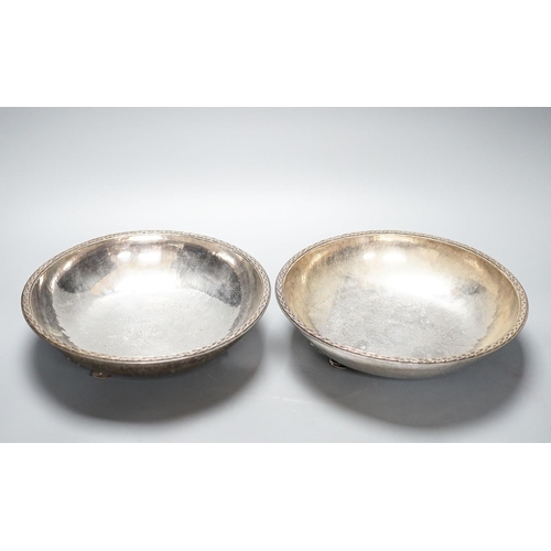 252 - A pair of Keswick School of Industrial Arts silver plated bowls, on stylised spade feet, 23cm diamet... 