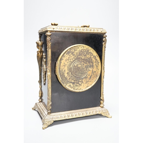 253 - A 19th century French ebonised and ormolu-mounted mantel clock with key, 27cm including handle... 