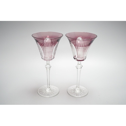 258 - A set of fourteen cut amethyst flashed wine glasses, 21cm