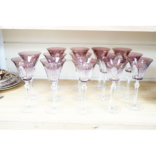 258 - A set of fourteen cut amethyst flashed wine glasses, 21cm