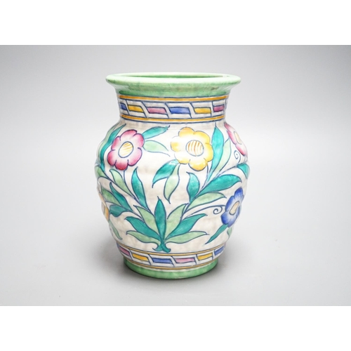 259 - A Charlotte Rhead vase, painted with flowers in polychrome enamels, 20cm