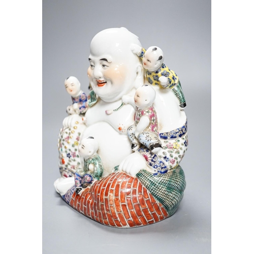 265 - A Chinese enamelled porcelain group of Budai and boys, 19cm high