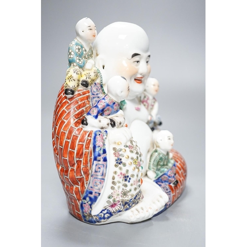 265 - A Chinese enamelled porcelain group of Budai and boys, 19cm high