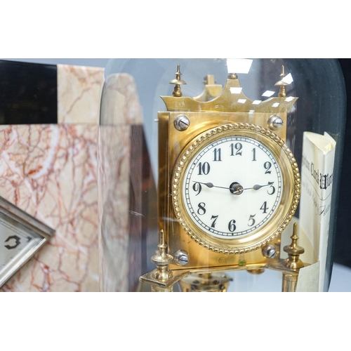 273 - An Art Deco rouge marble mantel timepiece, 45cm wide, quartz movement replacement and a brass annive... 