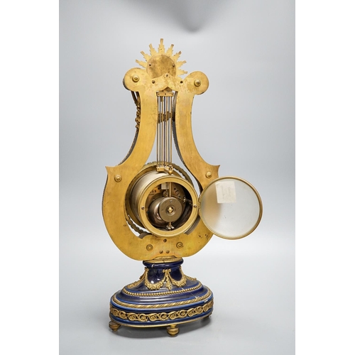 276 - A Louis XV style ormolu mounted blue glazed porcelain lyre-shaped mantel clock (AF) 49cm, paste set ... 