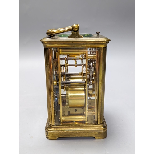 289 - A French brass repeating carriage clock with key. 13.5cm