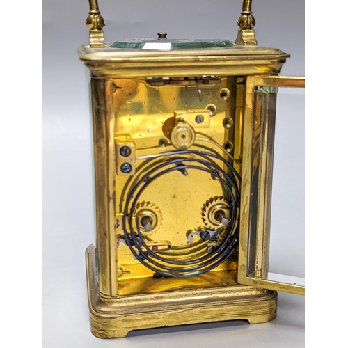 289 - A French brass repeating carriage clock with key. 13.5cm