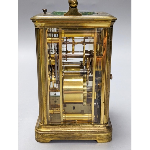 289 - A French brass repeating carriage clock with key. 13.5cm