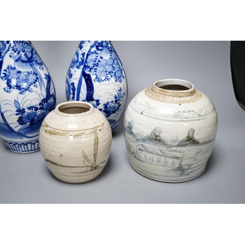 303 - Two provincial Chinese blue and white jars and a pair of Japanese vases 32cm