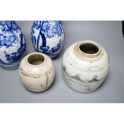 303 - Two provincial Chinese blue and white jars and a pair of Japanese vases 32cm