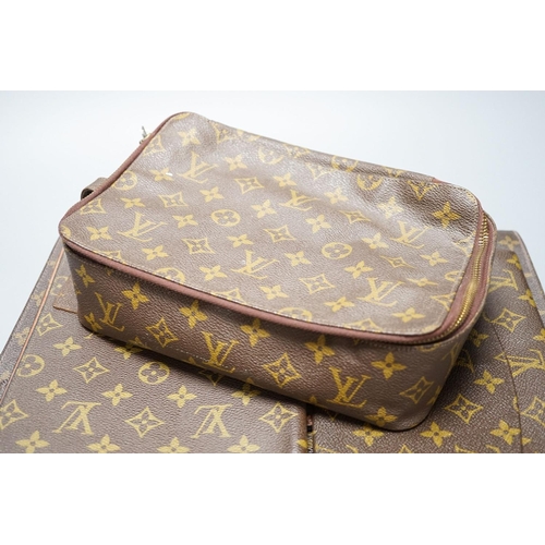 304 - Five Pieces of Louis Vuitton to including a toilet bag, and two soft cases.