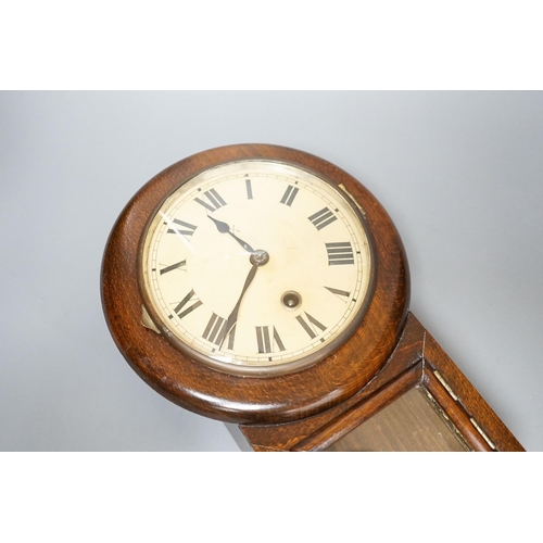 307 - A small late 19th century beech drop dial timepiece with key and pendulum 31cm