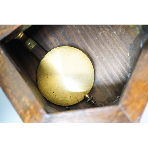 307 - A small late 19th century beech drop dial timepiece with key and pendulum 31cm